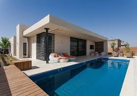 To make the light of the room you can install bamboo curtains. Simple Pool Family Home In Israel