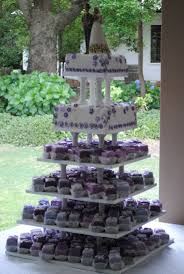 Die küchlein werden meist mit herrlichen cremes oder marzipan gefüllt und mit zuckerguss oder schokolade verziert. Purple Petit Four Wedding Cake Cupcake Tower Wedding Small Wedding Cakes Wedding Cake Inspiration