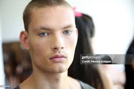 Model William Los prepares backstage before the Bench/Body... News Photo