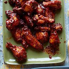 Michael symon's braised chicken fennel. Spicy Sriracha Chicken Wings Recipe Michael Symon Food Wine