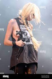 Wearing black tape crossed over her nipples, singer Taylor Momsen performs  live with The Pretty Reckless at the Download Festival at Donnington Park.  Donnington, UK. 6/12/11 Stock Photo - Alamy