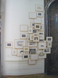 Interesting Picture Placement Some Are Hanging From The Ceiling Gallery Wall Design Wall Design