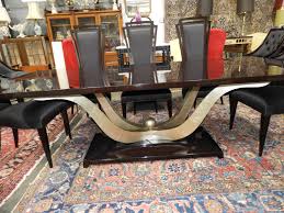 A captivating dining table design that adds practicality to glamour for a truly wonderful dining experience. Murrays Auctioneers Lot 162 Christopher Guy Quot Fontaine Quot Dining Table With Eight Christopher Guy Quot Savannah Quot Dining Chairs