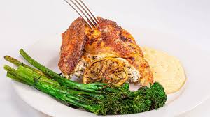 A Spatchcocked Cheesy Stuffed Chicken With Lemon Pepper Seasoning Is Roasted Until Crisp And Served Alongside Br In 2020 Stuffed Peppers Chicken Dinner Chicken Recipes
