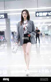 Jiang Shuying, also known as Maggie Jiang, a Chinese actress, appears with  blazer, white T-shirt and black shorts at an airport in Shanghai, China, 16  Stock Photo - Alamy