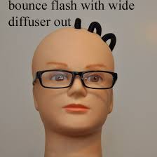 Bounce flash for people wearing glasses.