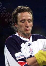 39671249-Barry Conlon l , scorer of Darlington s first-half goal, gets in a  clearance whilst under pressure from Lincoln s SImon Weaver r during their  Nationwide Division Three match at Sincil Bank, -
