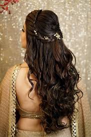 Braid the front side of your hair till the backside of your head and keep the other half of your hair all loose with slight curls for this gorgeous hairstyle for girls for wedding. Floral Hairstyles Every Indian Bride Needs To Check Out The Wedding Brigade Blog