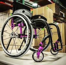 This Ki Mobility Rogue Has A Matte Black Finish Frame With The Purple Anodizing Package And Spinergy Manual Wheelchair Wheelchair Sports Wheelchair Accessories