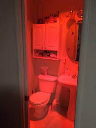 Taking a room from plain and bright to moody and bohemian is easily done with red lighting and multicolored light bulbs. This Red Light Installed In My Parents Bathroom That Is Supposed To Be Easier On Your Eyes If You Have To Get Up At Night Mildlyinteresting