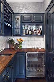 Deep rich blue cabinets with white farmhouse sink, white subway tile backsplash and white walls/ceiling. Navy Kitchens That Prove Classics Never Go Out Of Style Kitchen Design Kitchen Interior Kitchen Remodel