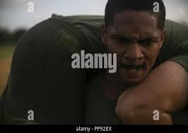 Sergeant Wesley Davison, a field radio operator with the 31st Marine  Expeditionary Unit, fireman carries a fellow noncommissioned officer during  a Force Fitness Instructor led High Intensity Tactical Training session at  Camp
