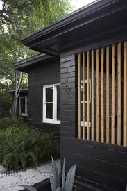The first floor of the house was painted using distemper paint, but after only four years it was brown instead of black. Start A Fire Home Exterior Makeover Black House Exterior Brick Exterior House