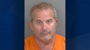 SUV crashes into pool-cleaning truck, driver arrested with suspended license