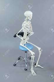 A skeleton sitting in his chair. Dentist Or Dental Assistant In Sitting Position On Mobile Chair Stock Photo Picture And Royalty Free Image Image 149113062