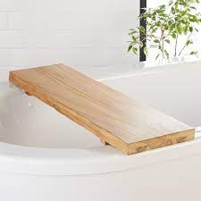 Bathtub trays can be made from various materials, but teak wood is the perfect match for a bathroom. Live Edge Wood Bath Caddy Reviews Cb2