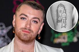 The tattoo, done in simple black line art, features a very young boy in his underwear and high heels while looking in the mirror. Xciaiyo7ct3 Rm