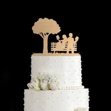A cake topper is a perfect opportunity to tastefully (no pun intended) infuse your personal style into your wedding day decor. Blissful Books Cake Topper Emmaline Bride Wedding Blog