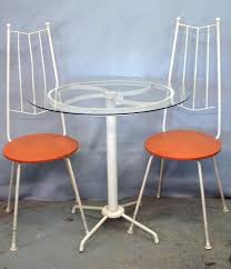 Choose one in a standard height for a large patio with lots of space. A Three Piece Mid Century Modern Bistro Set By Syd Leach Of Alabama Consisting Of 2 White Painted I