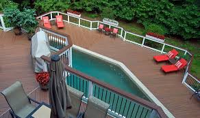 We are struggling to figure out what type of access door to do under the top stair landing since the louvers are too heavy and thick to make a hidden door with them. Wood Pool Decks Landscaping Network