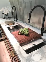 A galley workstation is a central hub over your sink reinventing your kitchen by allowing you to prep, cook, serve, entertain, and clean all in one workspace. Fab New Sinks From The Kitchen And Bath Show Kbis Designed