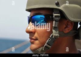 STRAIT OF HORMUZ (Jul. 25, 2018) Executive Officer, Cmdr. Pat Eliason,  right, stands watch with Lt. Dan Stayton, middle, and Ensign Ryan Slaughter  as the guided-missile destroyer USS The Sullivans (DDG 68)
