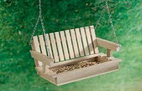 Unique bird feeders for wild birds around your home. Porch Swing Bird Feeder Diy Bird Feeder Unique Bird Feeders Craft Stick Crafts