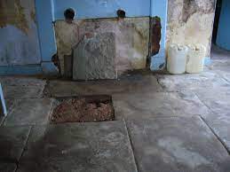 Laying stone floor tiles on concrete. Stone Floors