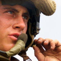 Lance Corporal George H. Burton, USMC, Driver, Charlie Company 1ST Light  Armored Reconnaissance (LAR) "War Pigs" from the 13th Marine Expeditionary  Unit (Special Operations Capable) (MEU (SOC)), cleans up during a brass