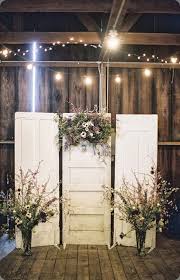 A Clever Way To Use Old Doors And Dried Flowers To Create A Rustic Backdrop For Rustic Farm Wedding Vintage Wedding Decorations Rustic Farms