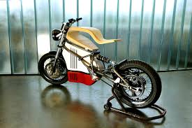 The café racer electric motocross bike gives you speeds up to 55 mph and a driving range up to all the motors and batteries are manufactured under the direct supervision of personnel within the. E Raw Is An Electric Cafe Racer Prototype With A Truly Raw Wooden Seat Autoevolution
