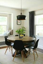 It's made from solid wood, with a circular surface set on four flared, tapered legs. Pin By Anna Bjork Sigurjonsdottir On Beach House Round Dining Table Modern Round Dining Room Beautiful Dining Rooms