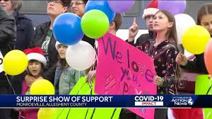 COVID-19 patient's family gathers outside hospital