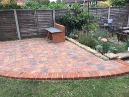 Corner Patio Edged With Matching Brick Border Garden Paving Garden Pavers Patio Edging