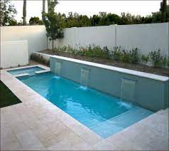 This stunning pool has an antigua pebble finish, tanning ledge and 5 bar seats. Top Tips To Design A Small Pool For A Family Of Four Lap Pools Backyard Small Pool Design Backyard Pool Designs