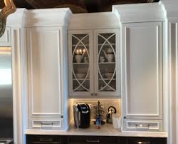 Your kitchen is updated and with coastal gray cabinets with glass doors and lighting, stainless steel double bowl kitchen sink, and easy access to lanai. Blog Busby Cabinets
