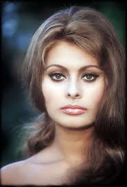 When I look at Sophia Loren, I see the ideal woman in every sense. She sets  the bar so high. This is one of my many autographed pictures from her, seen  here