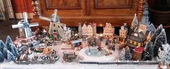 Make Your Own Dutch Christmas Village The Windmills Turn And The Skaters Dance Around The Frozen Pond Love It Christmas Village Christmas Frozen Pond