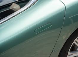 Image result for Almond Green 2010 Aston Martin