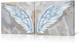 These metal angel wings can be found here on amazon. Homeoart Angel Wings Home Decor White Wing Of Angel Modern Canvas Painting Giclee Art Prints Stretched Framed Artwork Bedroom Living Room Decor 16 X16 X2 Panels Buy Online At Best Price In Uae
