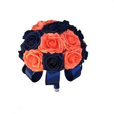 Lush mixed bouquets of florals including roses, stock in shades of coral and pink wrapped in soft pink satin ribbon. Weddings Wedding Flowers Navy Blue Burlap Bridal Bouquet Set Pantone Living Coral Wedding Bouquet Set Coral Coral Orange Sola Wood Flowers Bouquets Corsages