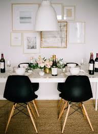 Black And White Dining Room Furniture Black Eiffel Chairs White Table White Art White Walls Natural Rug Love Contemporary Home Decor Dining Room Decor Dining Room Inspiration
