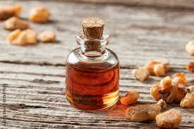 A bottle of styrax benzoin essential oil with benzoin resin Stock Photo |  Adobe Stock