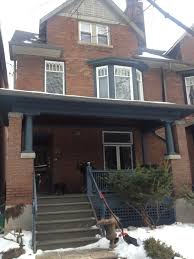 As with priming, begin painting 1 foot (0.30 m) from the bottom of the wall and 6 inches (15 cm) from the corner. Another Brown Brick House With Blue Trim In The Area Brown Brick Houses House Colors Building A New Home