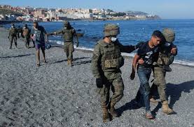 Bordered by morocco, it lies along the boundary between the mediterranean sea and the atlantic ocean and is one of nine populated. Spain Vows To Restore Order After Thousands Swim Into Ceuta From Morocco World News Us News
