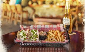 It was an instant success with the locals, beachgoers and sun seekers from around the world.â now its 2013 and the sensation continues. Key West Bar Food Key West Pub Food Island Dogs Bar