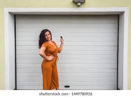 Our garages are zoned for active use storage meaning that you can work on your car, have a workshop, store your business inventory, or simply store your personal items in our premium. Garage Door Pvc Girl Young Woman Stock Photo Edit Now 1449780926