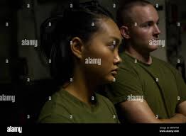 Lance Cpl. Amy Phan (left) and 2nd Lt. Ethan Treacy pay attention to  instructions from their martial arts instructor aboard the USS Bonhomme  Richard (LHD 6) while underway in the Pacific Ocean,