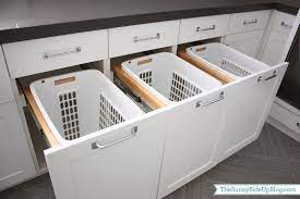 The hamper is easily removable to transfer clothes to the washer. Downstairs Laundry Room The Sunny Side Up Blog Laundry Room Hamper Laundry Room Inspiration Laundry Room Organization