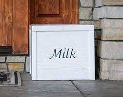 Do you remember when the milk man delivered fresh milk in bottles to your front door? Porch Milk Box Etsy